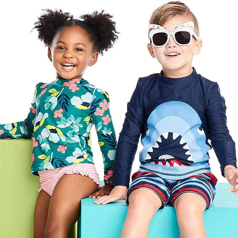 The 10 Best Rash Guards For Keeping Your Kids Safe From The Sand And Sun